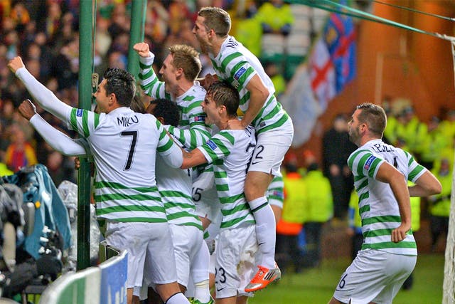 Celtic players surround Victor Wanyama after he scored the opening goal 