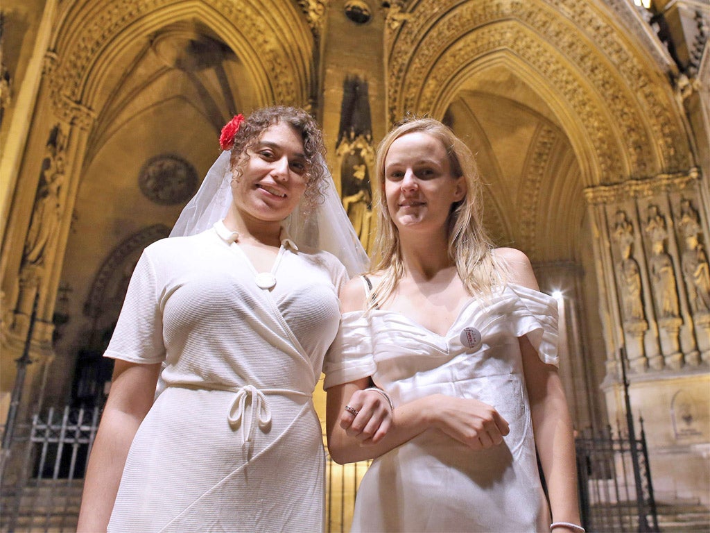 Members of a feminist collective stage a fake gay wedding at the Basilique Sainte-Clotilde in Paris