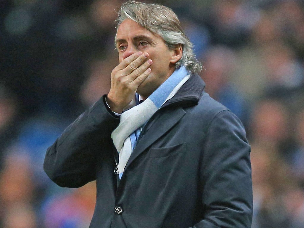 Roberto Mancini looks on during Manchester City’s draw with Ajax