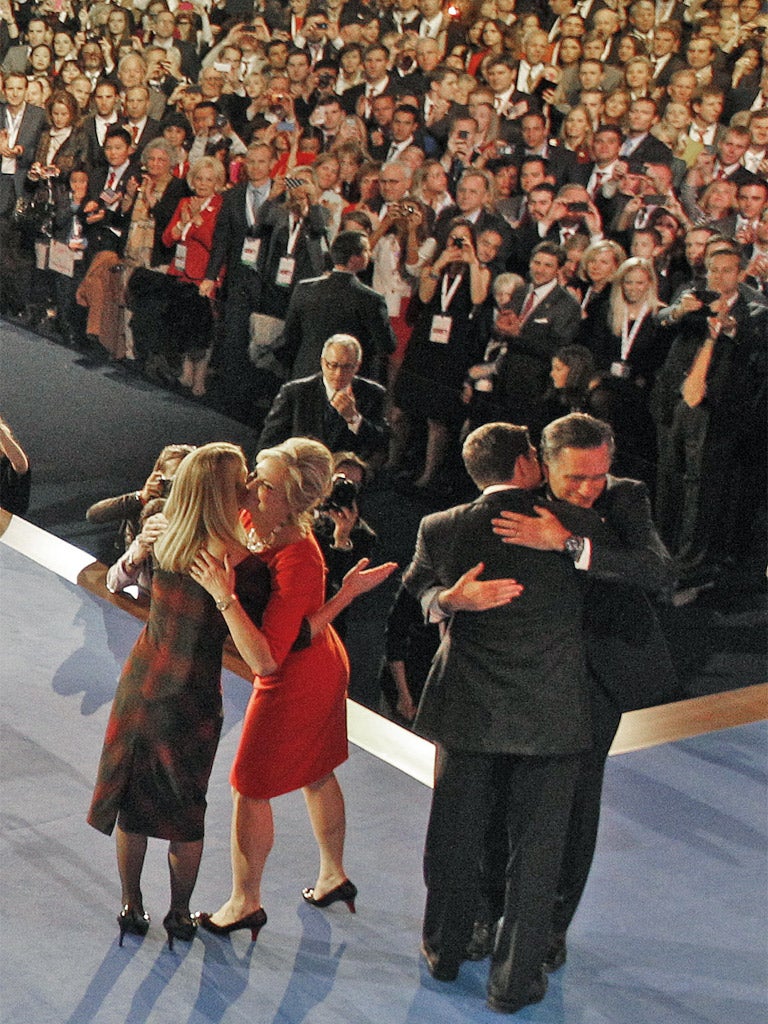 Mitt Romney and Paul Ryan, and their wives Ann and Janna, embrace after Mr Romney concedes defeat