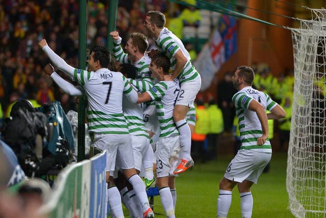 Victor Wanyama is mobbed by his Celtic team-mates