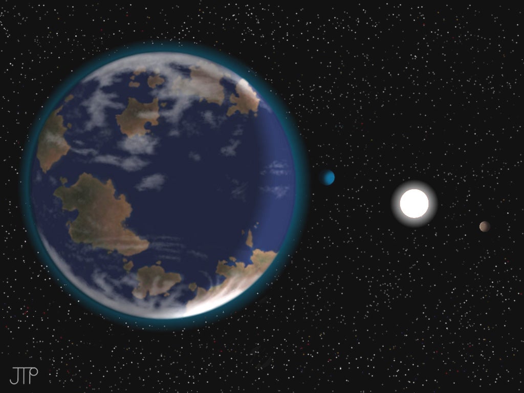 Photo issued by the University of Hertfordshire of an artist's impression of the Earth-like planet HD 40307g in the foreground