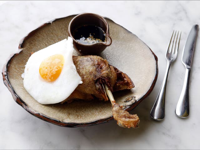The dish making foodies go quackers: duck leg with waffles, egg and maple syrup, prepared by Tom Cenci