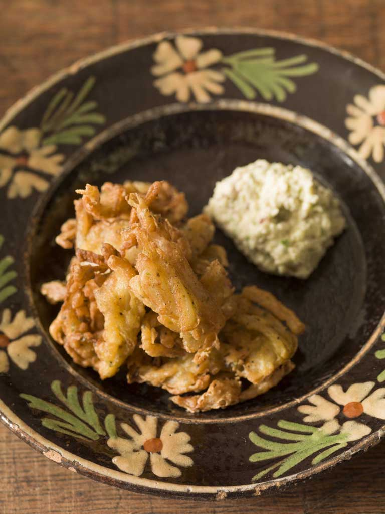 Onion fritters with apple and green chilli relish