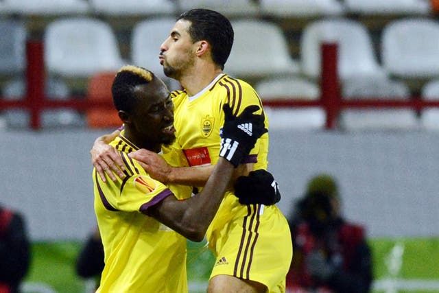 Anzhi Makhachkala's player Lacina Traore (left) celebrates with Mbark Boussoufa after scoring against Liverpool