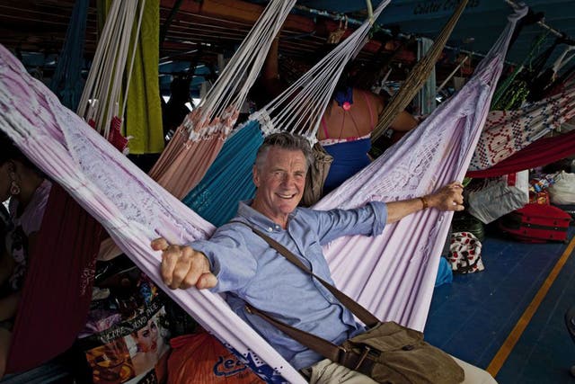 Michael Palin on a boat to Amazonia