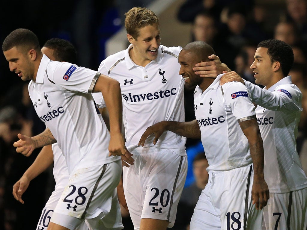 Jermain Defoe of Tottenham Hotspur celebrates scoring their second goal with Michael Dawson and Aaron Lennon - Defoe scored all three goals during the game
