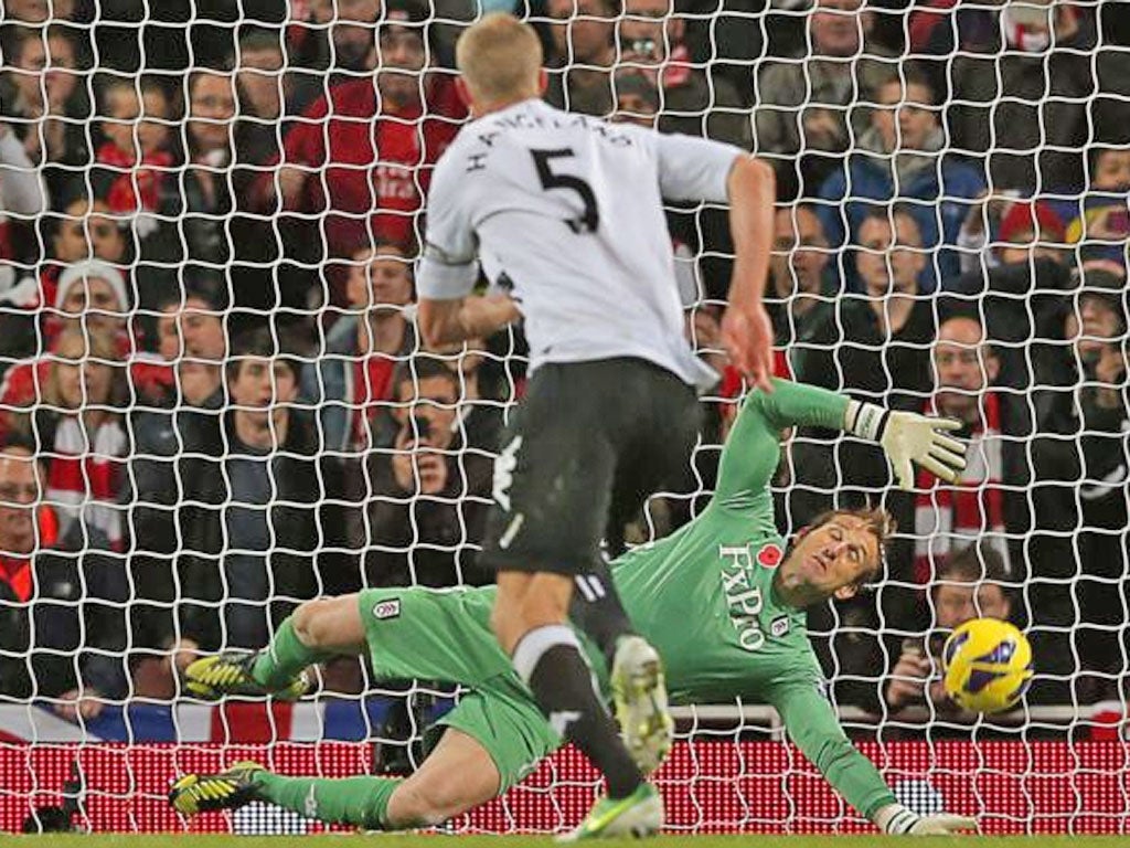 Mark Schwarzer of Fulham saves the penalty of Mikel Arteta of Arsenal