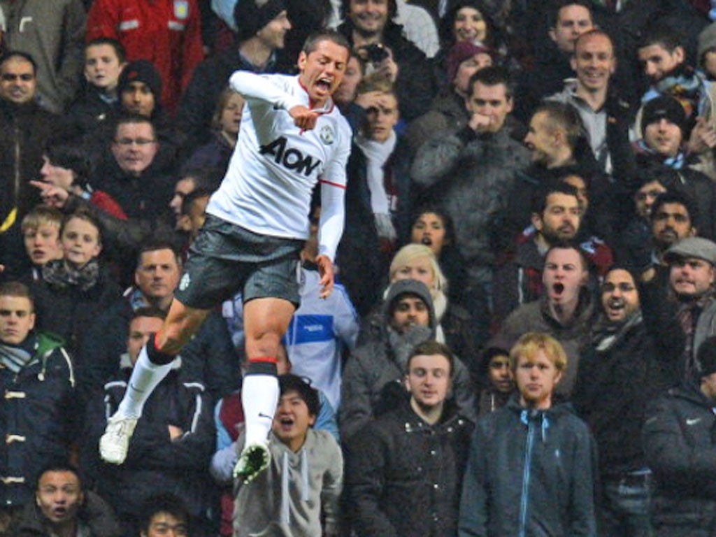 Manchester United's Mexican striker Javier Hernandez celebrates scoring his second goal against Aston Villa