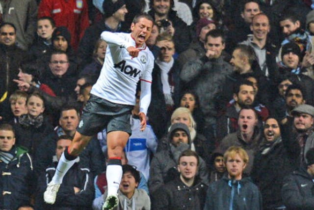 Manchester United's Mexican striker Javier Hernandez celebrates scoring his second goal against Aston Villa