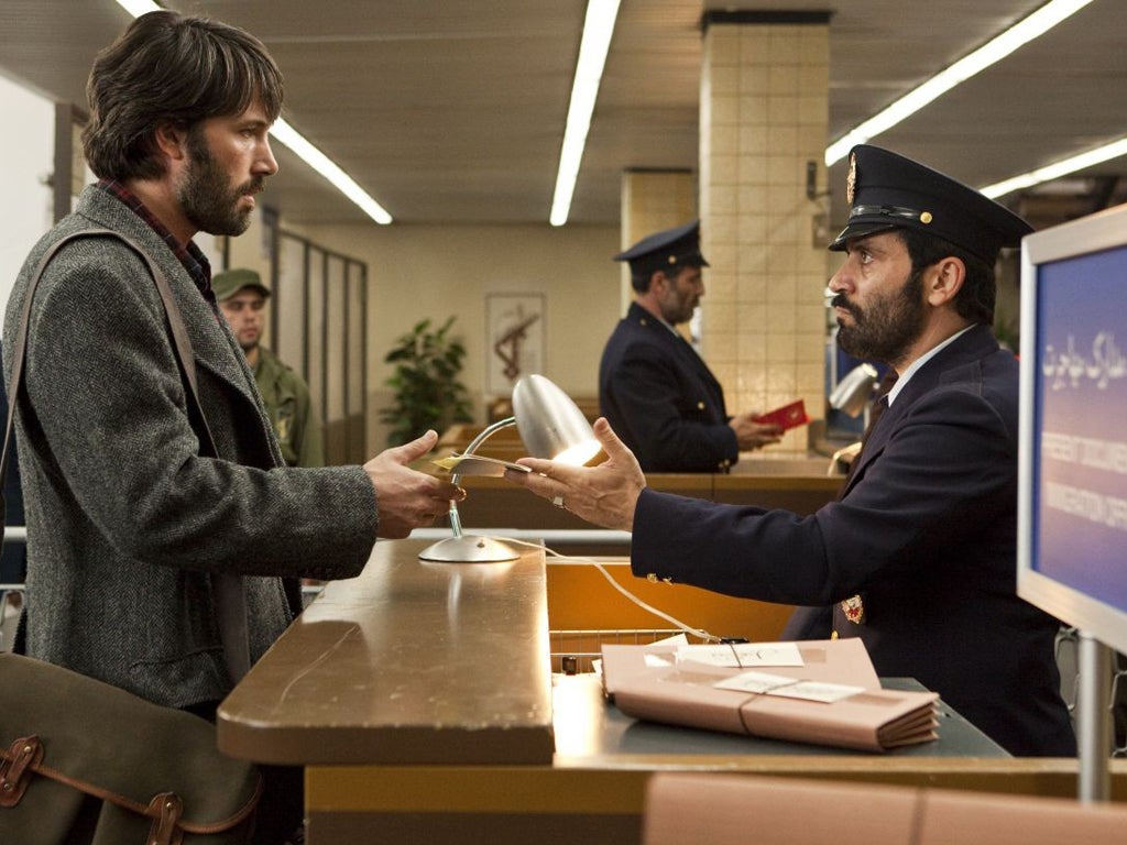 Ben Affleck, left, plays CIA agent Tony Mendez in 'Argo', which he also directed