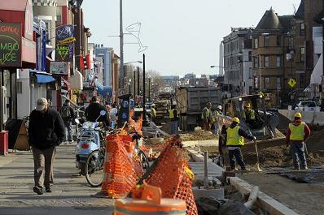 SEWAGE: Construction workers replace aging sewage and gas lines, and add underground fiber optics, on 18th Street in March in Washington, D.C. While sewage backups aren’t as destructive as Hurricane Sandy, they highlight leaky systems in cash-strapped cit