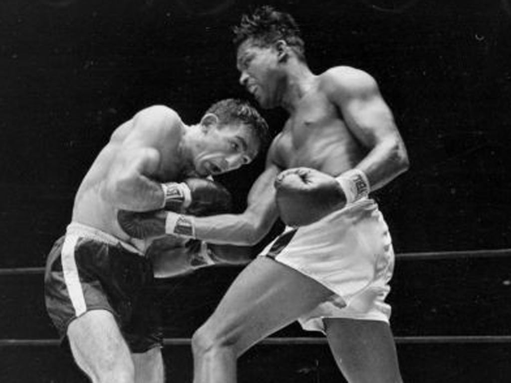 The late Carmen Basilio (left) fights Sugar Ray Robinson in 1957