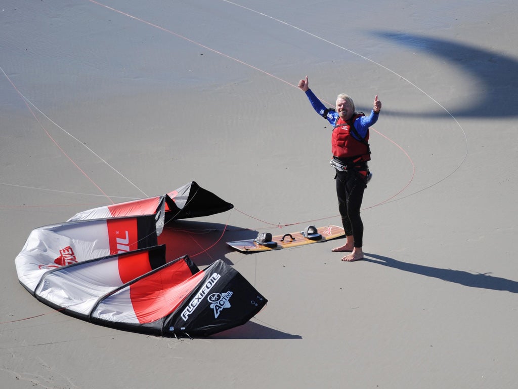 Sir Richard Branson completes a kitesurf across the Channel