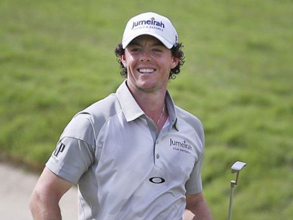 Rory McIlroy celebrates his 30-foot putt on the final green