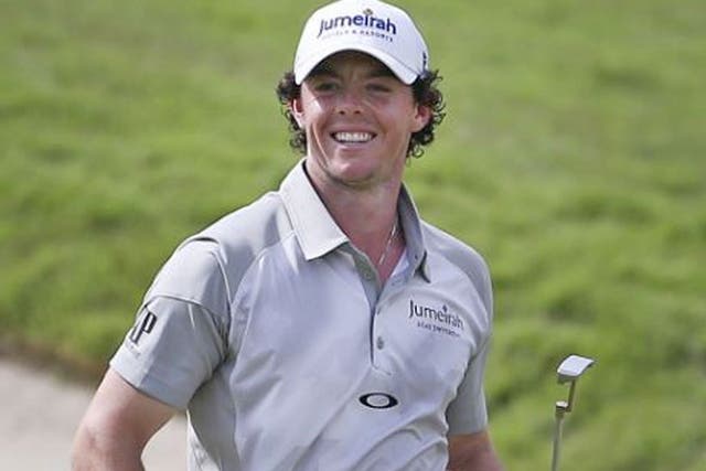 Rory McIlroy celebrates his 30-foot putt on the final green