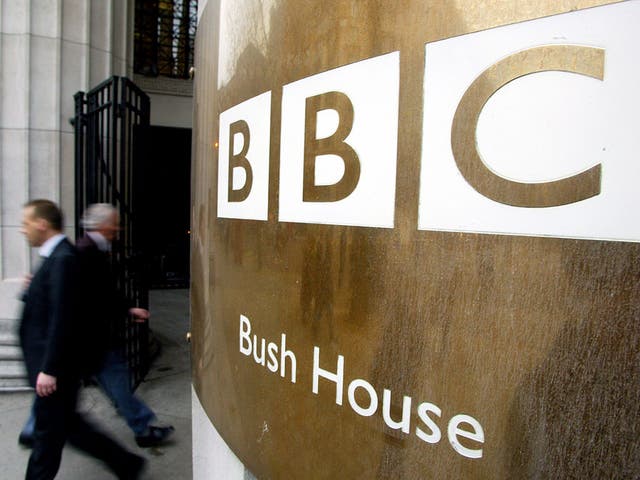 Pedestrians walks past the doors of the BBC's Bush House in London 07 December, 2004.