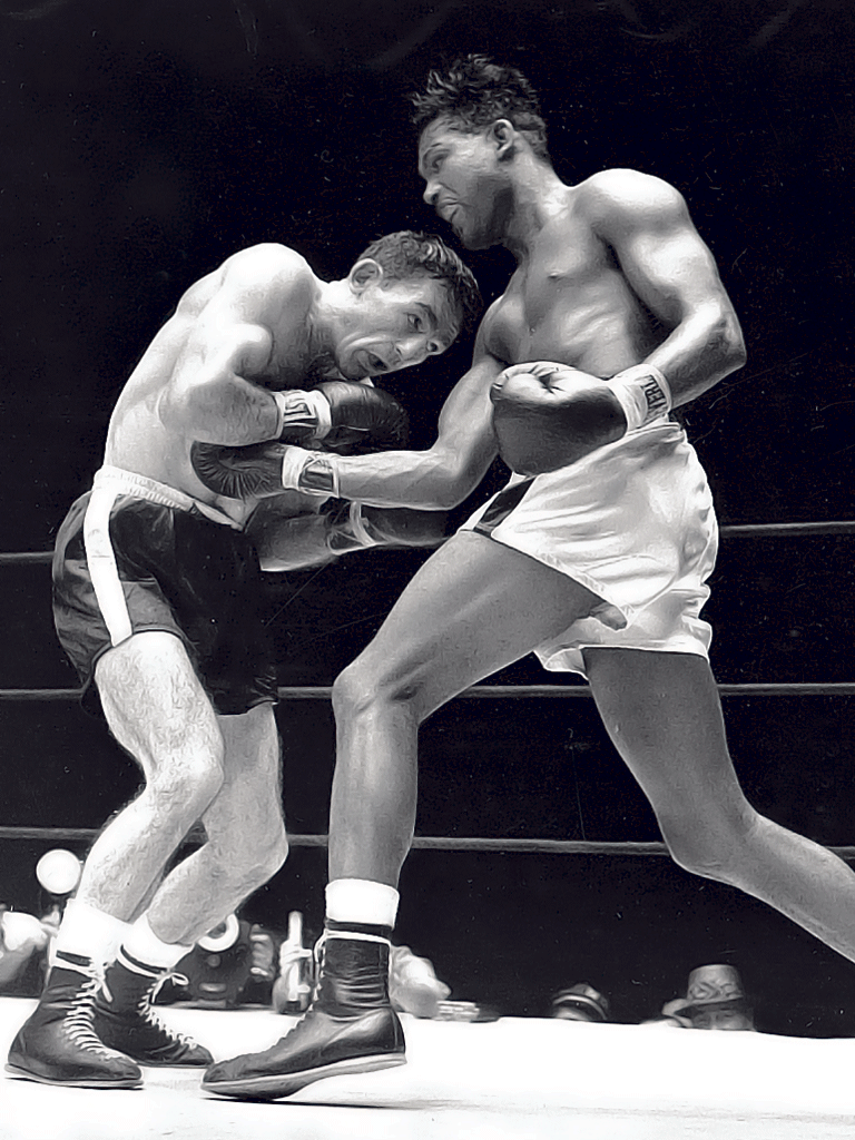 Basilio, left, on his way to victory over Sugar Ray Robinson in 1957