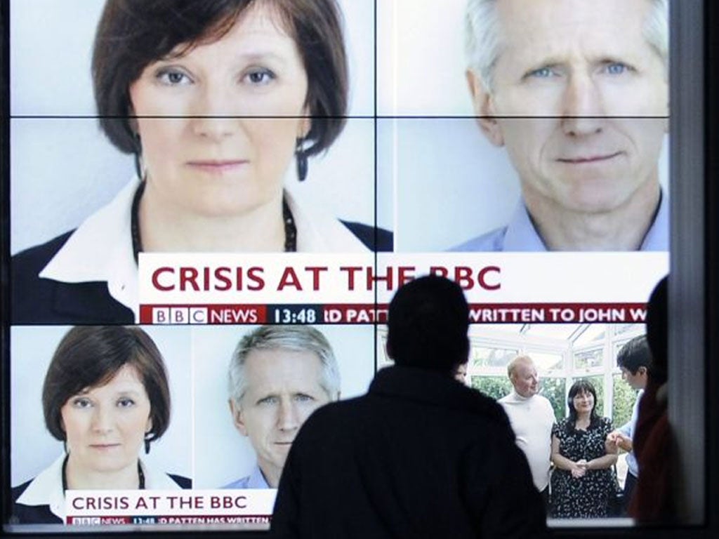 A Broadcasting House screen shows the BBC’s director of news,
Helen Boaden, and her deputy, Stephen Mitchell, both of whom have
‘stepped aside’