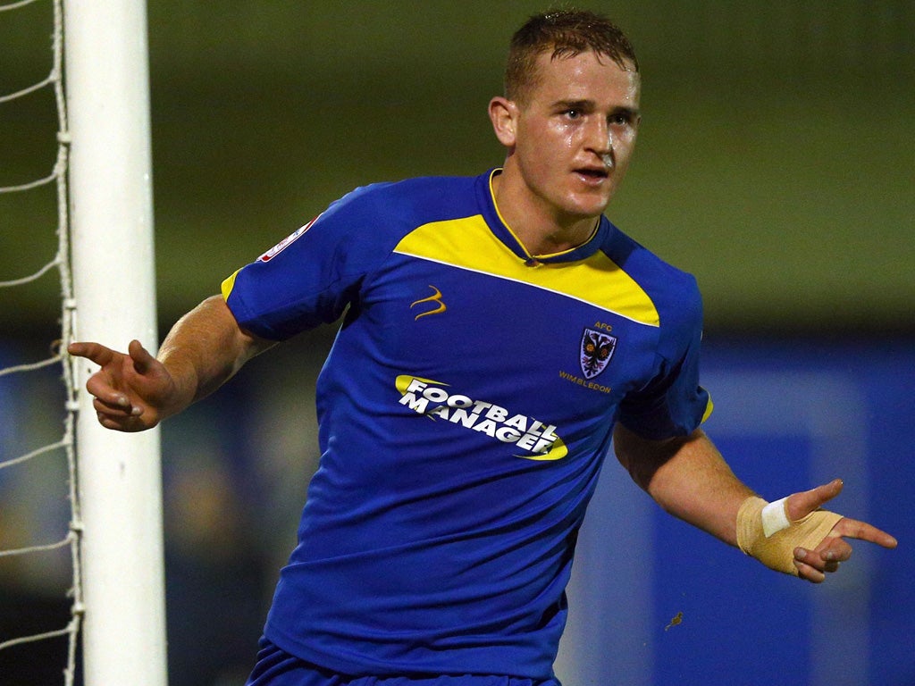 Charlie Strutton: AFC Wimbledon striker scored twice as his side made it through the replay