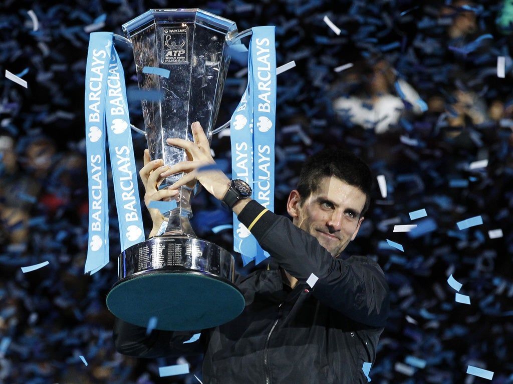 Novak Djokovic celebrates winning the ATP World Tour final last night