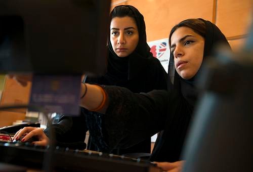 SAUDI WOMEN: Zainab Al Talib, left, assists legal consultant Tala Al-Hejailan at the law offices of DLA Piper in Riyadh, Saudi Arabia on October 8. Hejailan is a lawyer, but cannot practise law in Saudi Arabia, which will not grant licences to women.