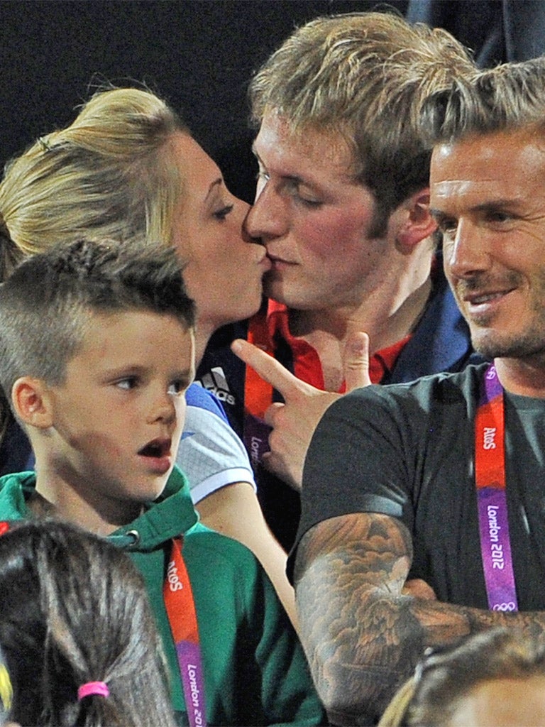 Jason Kenny and Laura Trott kissing while seated behind David Beckham was one of the images of the Games