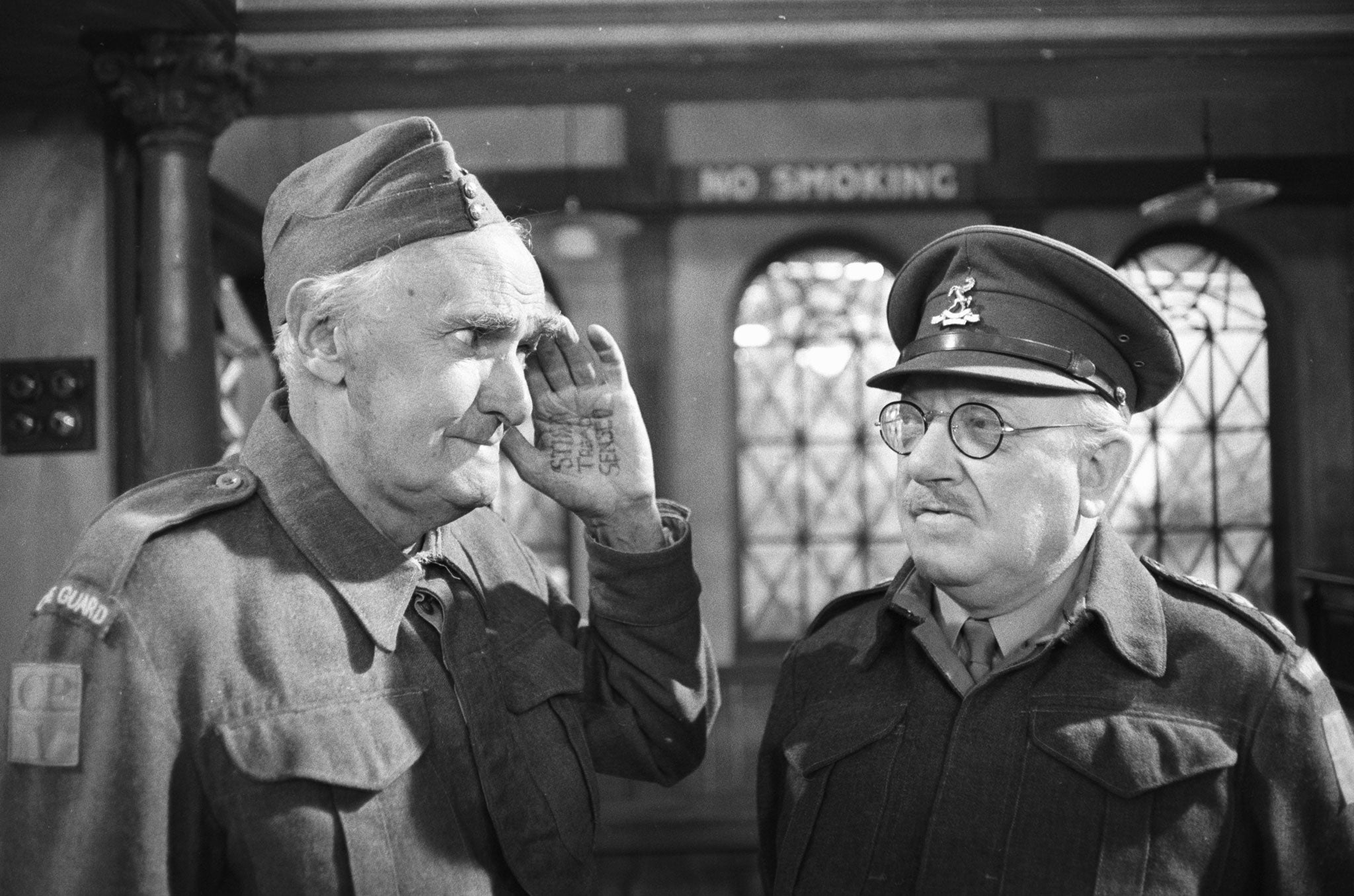 John Laurie (Private Frazer) and Arthur Lowe (Captain Mainwaring) during an episode of the BBC comedy series 'Dad's Army' filmed on July 30, 1977.