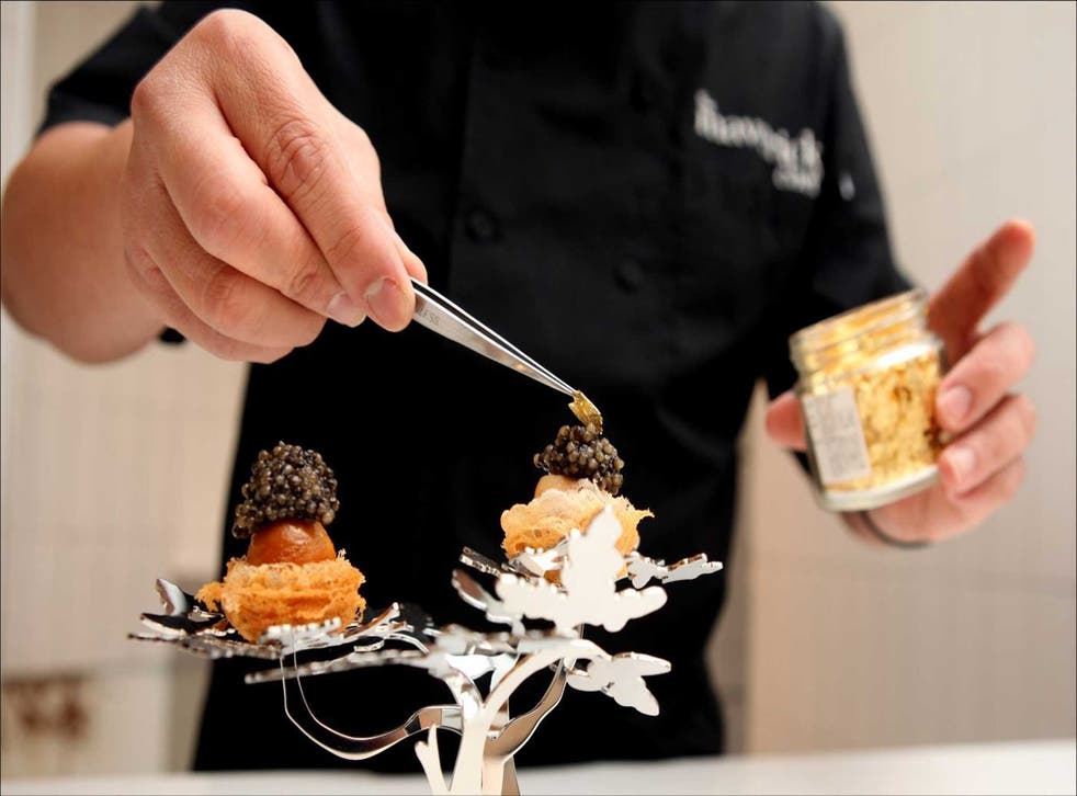 Little China: Leung adds the finishing touches to his 'Bed and Breakfast' dish - caviar, quails' eggs and gold flake