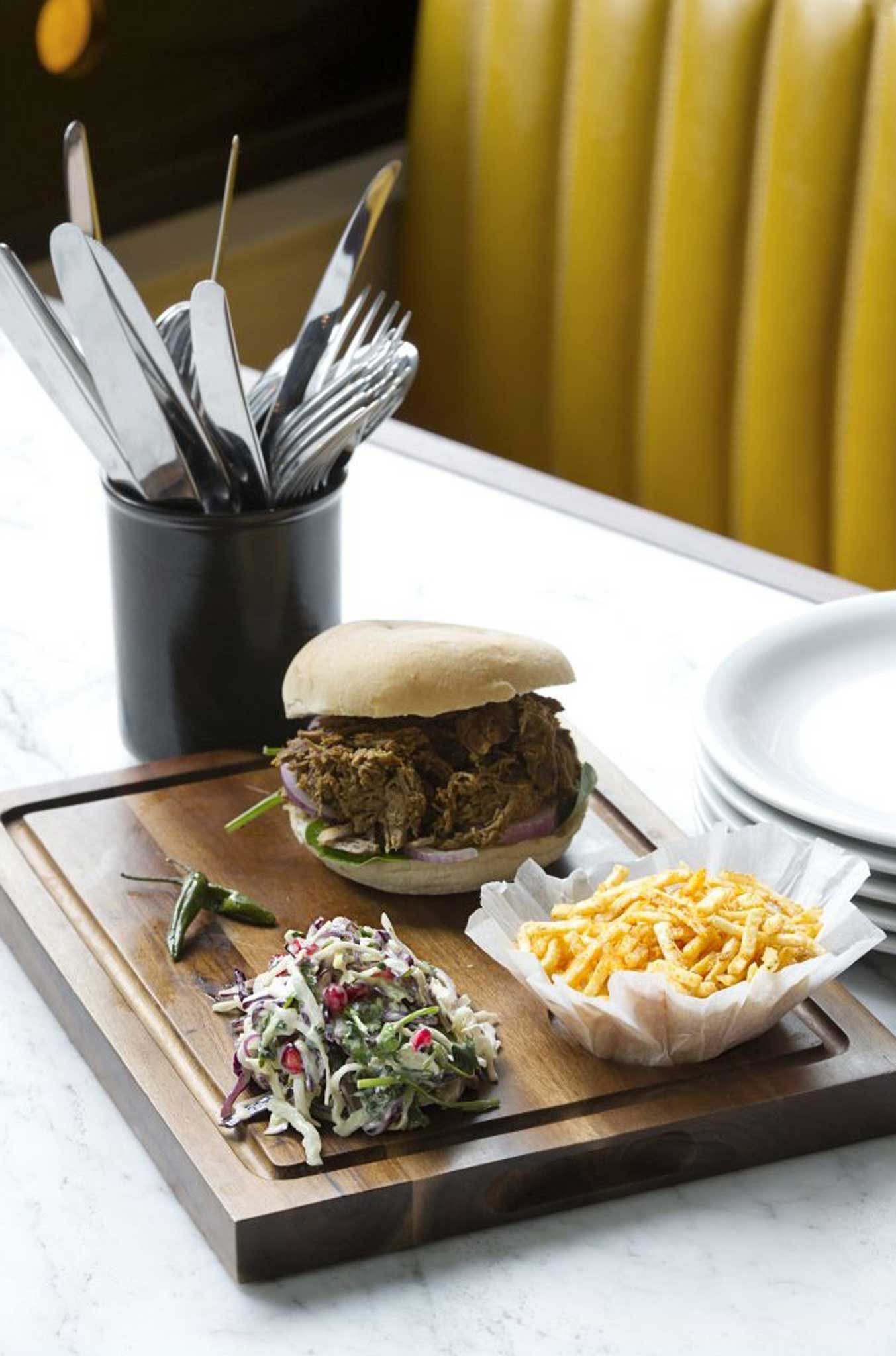 Dishoom's lamb raan bun is made from pulled lamb bursting with juices