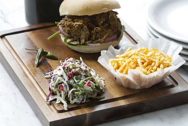 Dishoom's lamb raan bun is made from pulled lamb bursting with juices