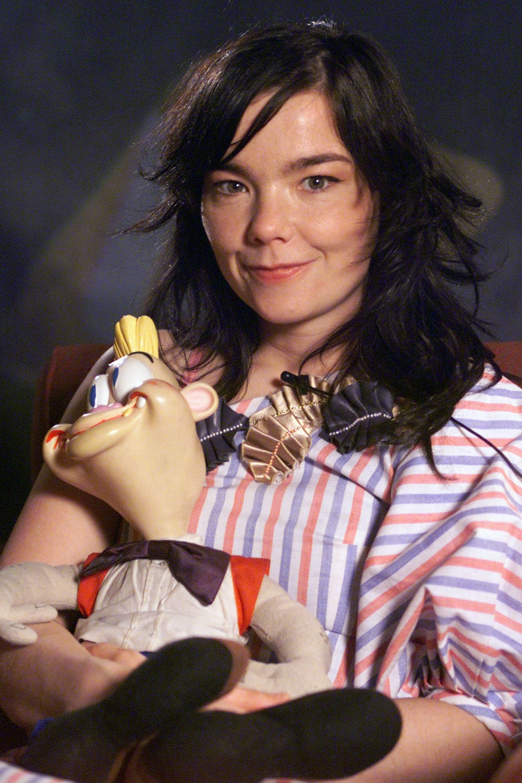 Bjork poses with a doll created by John Kricfalusi, creator of Wren and Stimpy and who also directed one of Bjork video's, during an interview for Getmusic at the Elektra offices in New York City