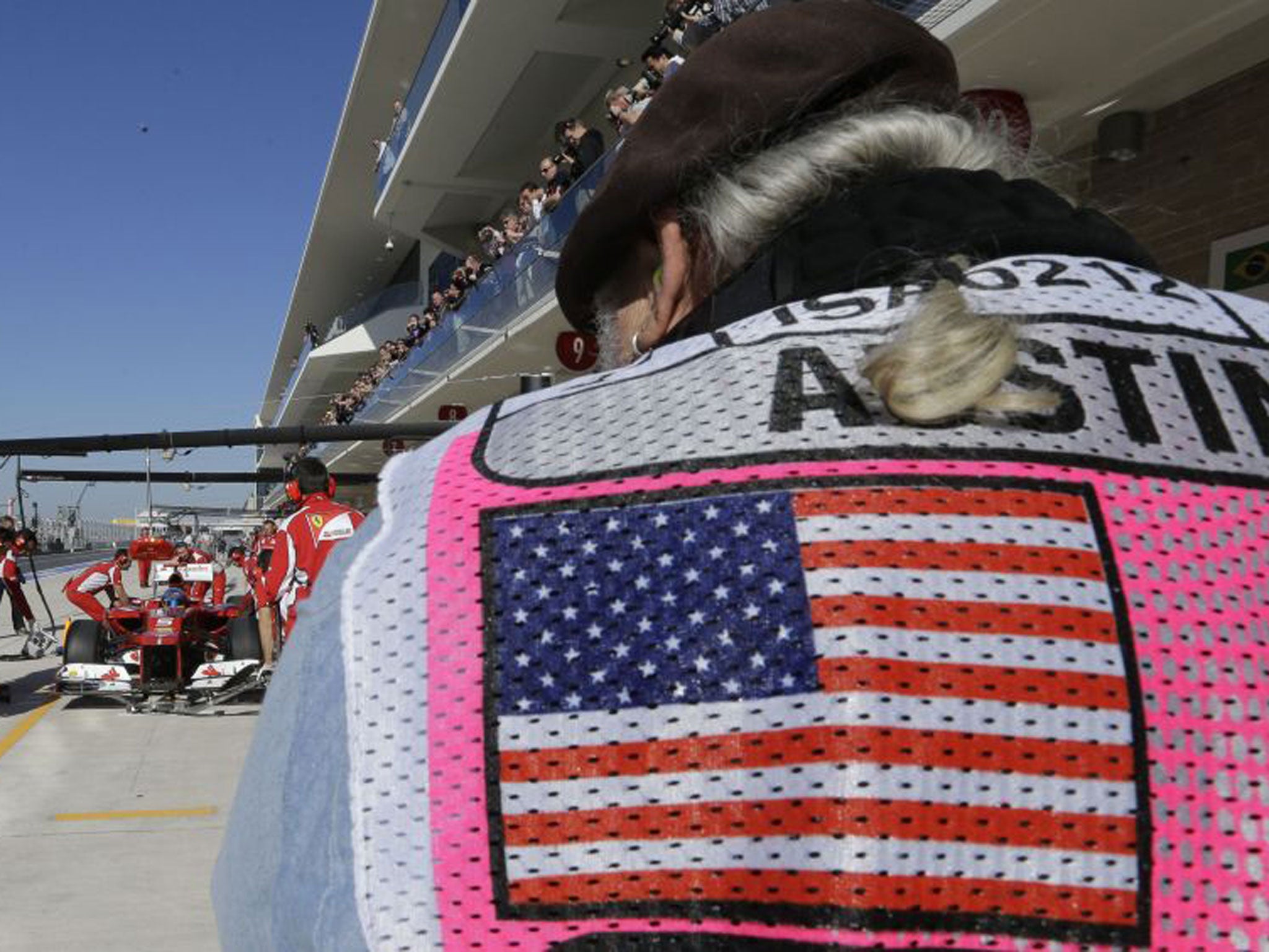 A photographer takes a picture during practice yesterday