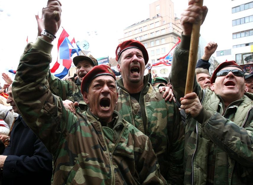 Croatian veterans cheer in Zagreb yesterday after UN appeal court judges quash the convictions of Mladen Markac