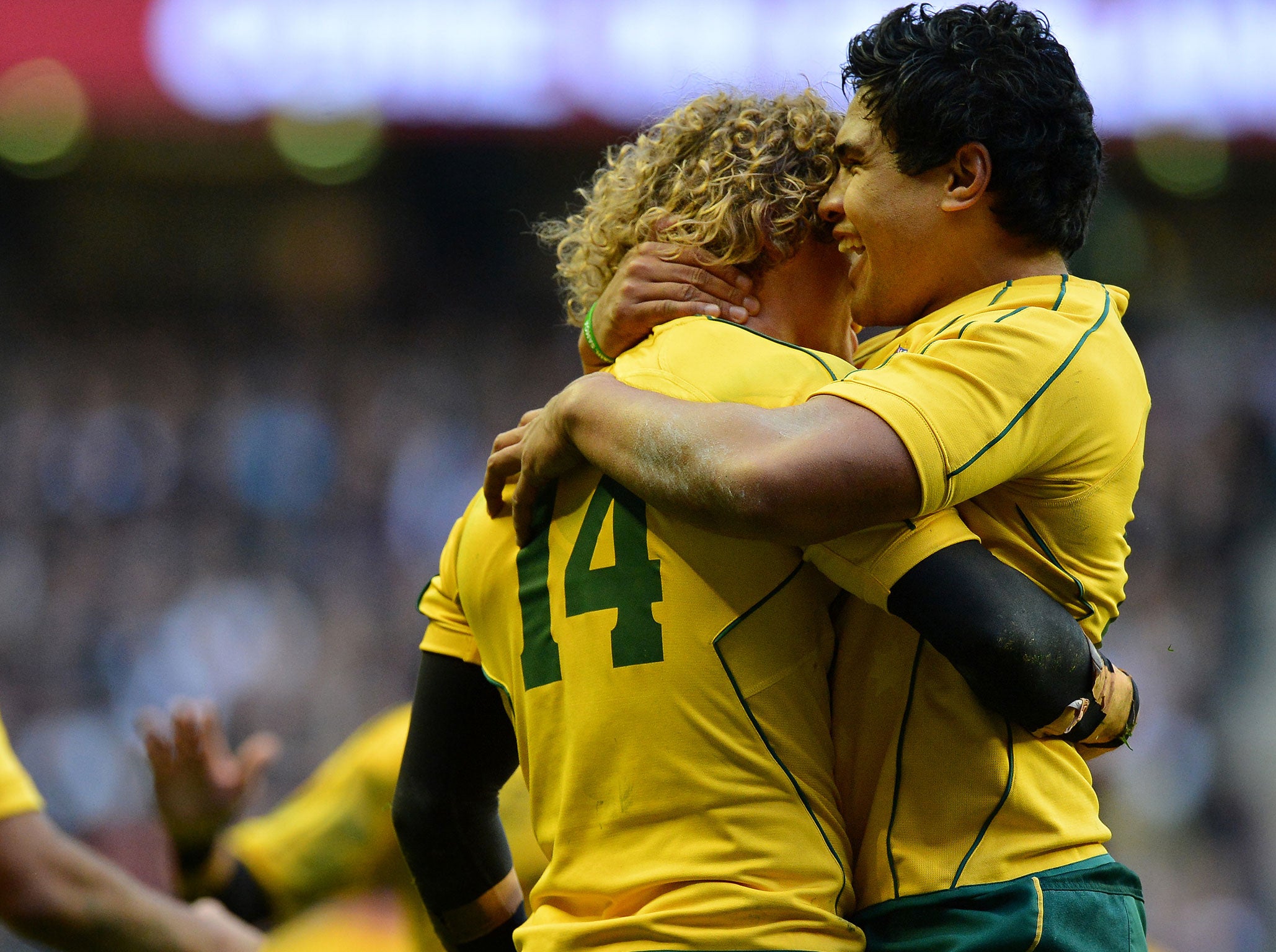 Australia's Nick Cummins (left) celebrates with centre Ben Tapuai after scoring a try