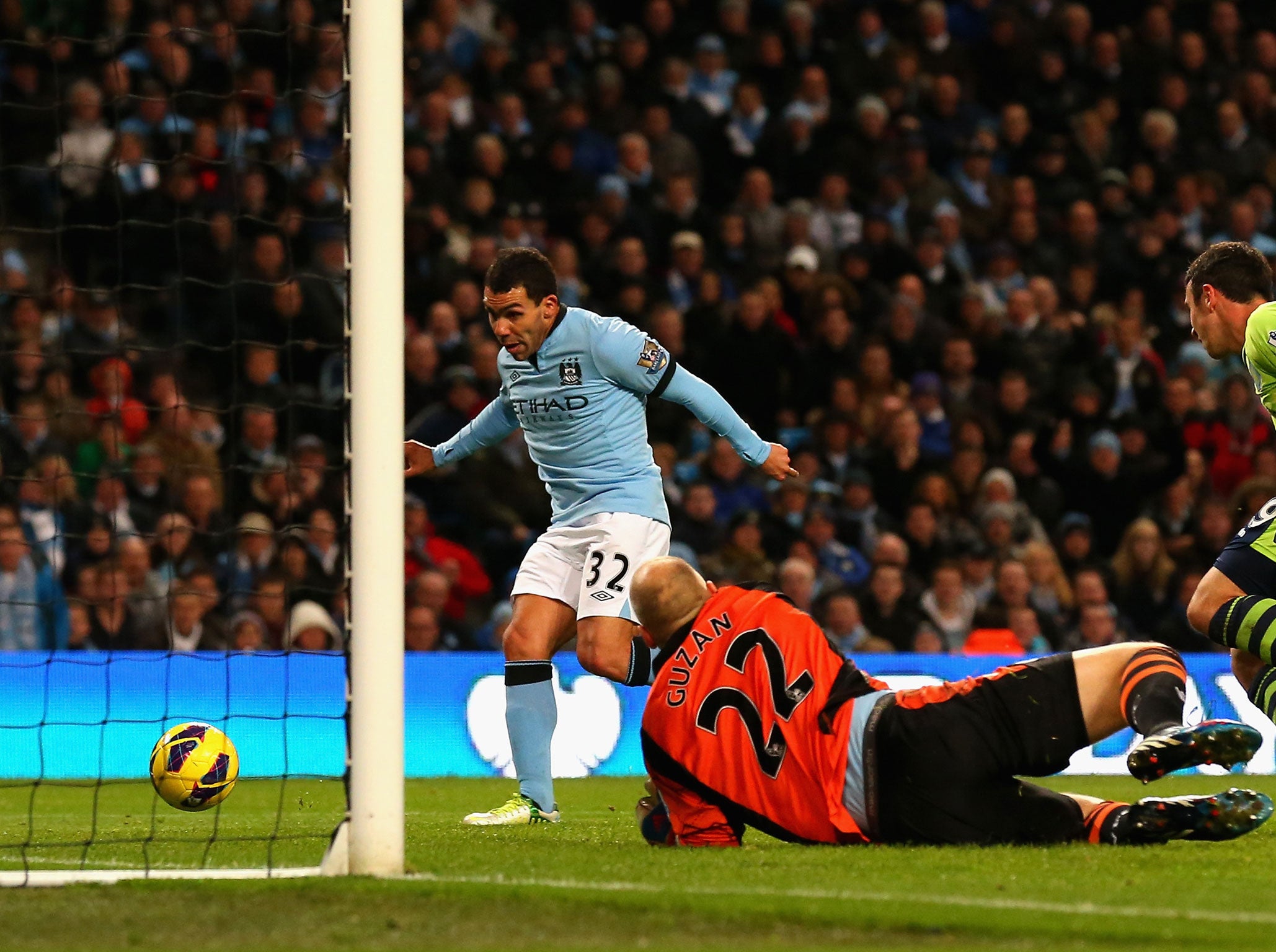 Carlos Tevez slots his second goal past Aston Villa keeper Brad Guzan