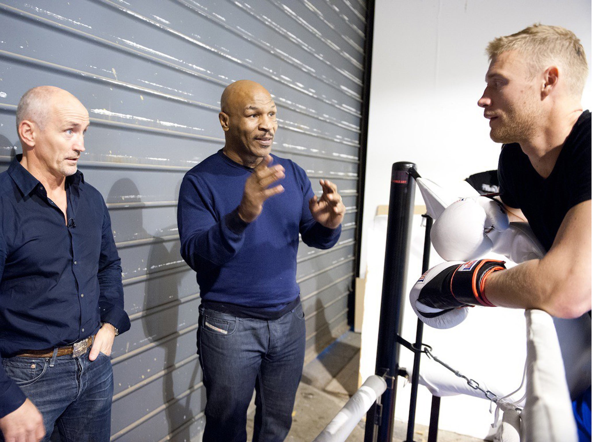 Ring the changes: Andrew Flintoff and his trainer Barry McGuigan (far left) receive some advice from Mike Tyson