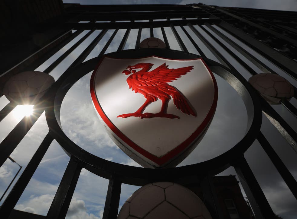 Liverpool FC emblem on Anfield stadium’s gates. Victims’ families want inquiries to be ‘knitted together’