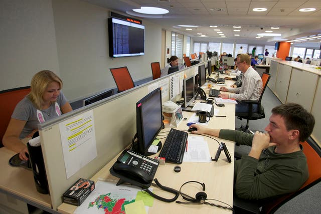 RUSSIA TIME: Employees work at computer screens at the RTS Stock Exchange in Moscow.
