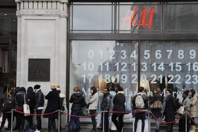 Shoppers queue outside an H&M store for the launch of Maison Martin Margiela's special collection