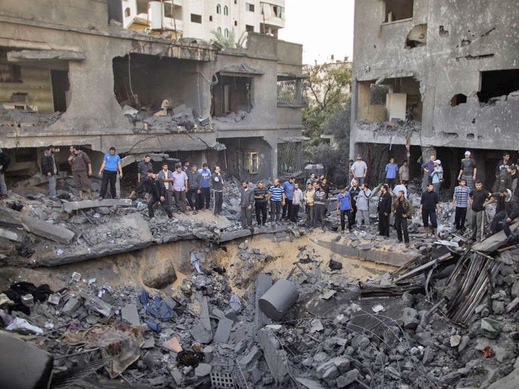 The aftermath of the Israeli air strike on the al-Dallu family home