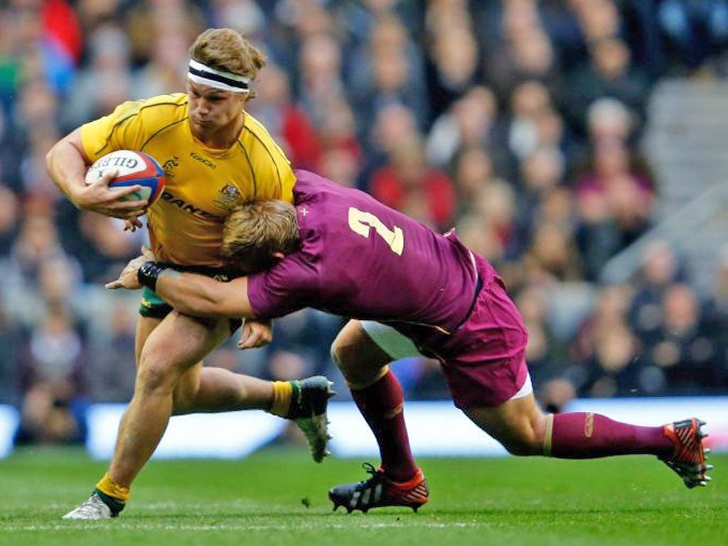Michael Hooper is tackled by Tom Youngs at Twickenham