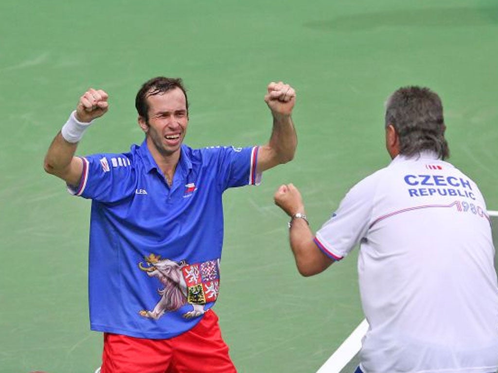 Radek Stepanek of Czech Republic celebrates after match point with team captain Jaroslav Navratil after his four set victory against Nicolas Almagro of Spain during day three of the final Davis Cup match