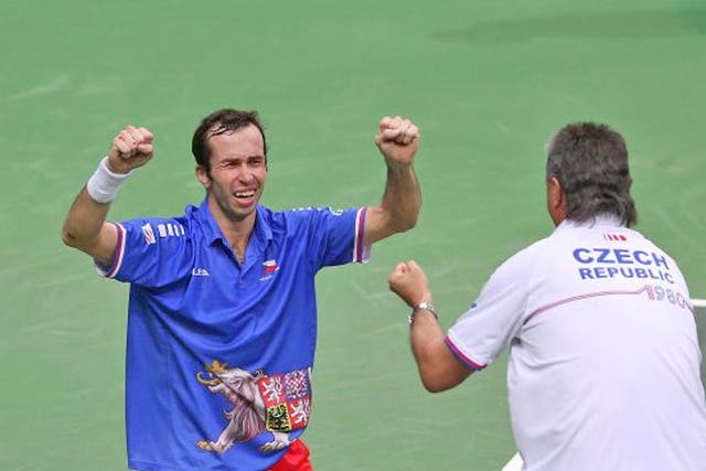 Radek Stepanek of Czech Republic celebrates after match point with team captain Jaroslav Navratil after his four set victory against Nicolas Almagro of Spain during day three of the final Davis Cup match