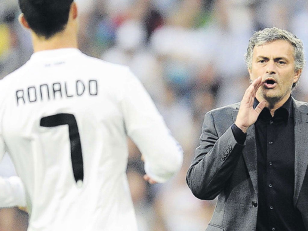 Jose Mourinho shouts instructions to Cristiano Ronaldo