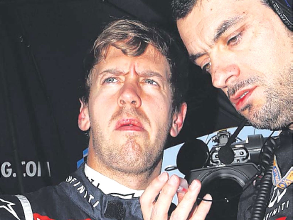 Sebastian Vettel consults his race engineer before yesterday’s race