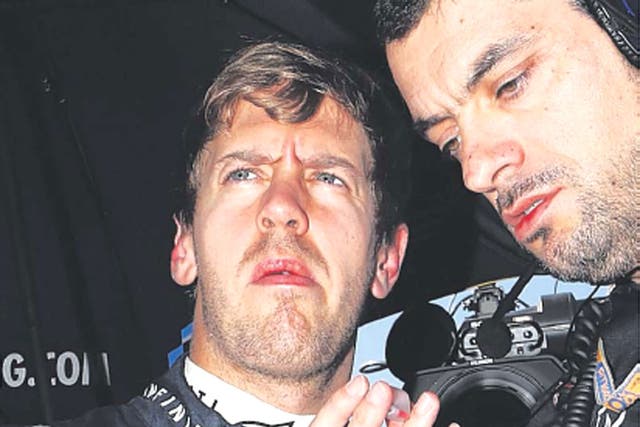 Sebastian Vettel consults his race engineer before yesterday’s race