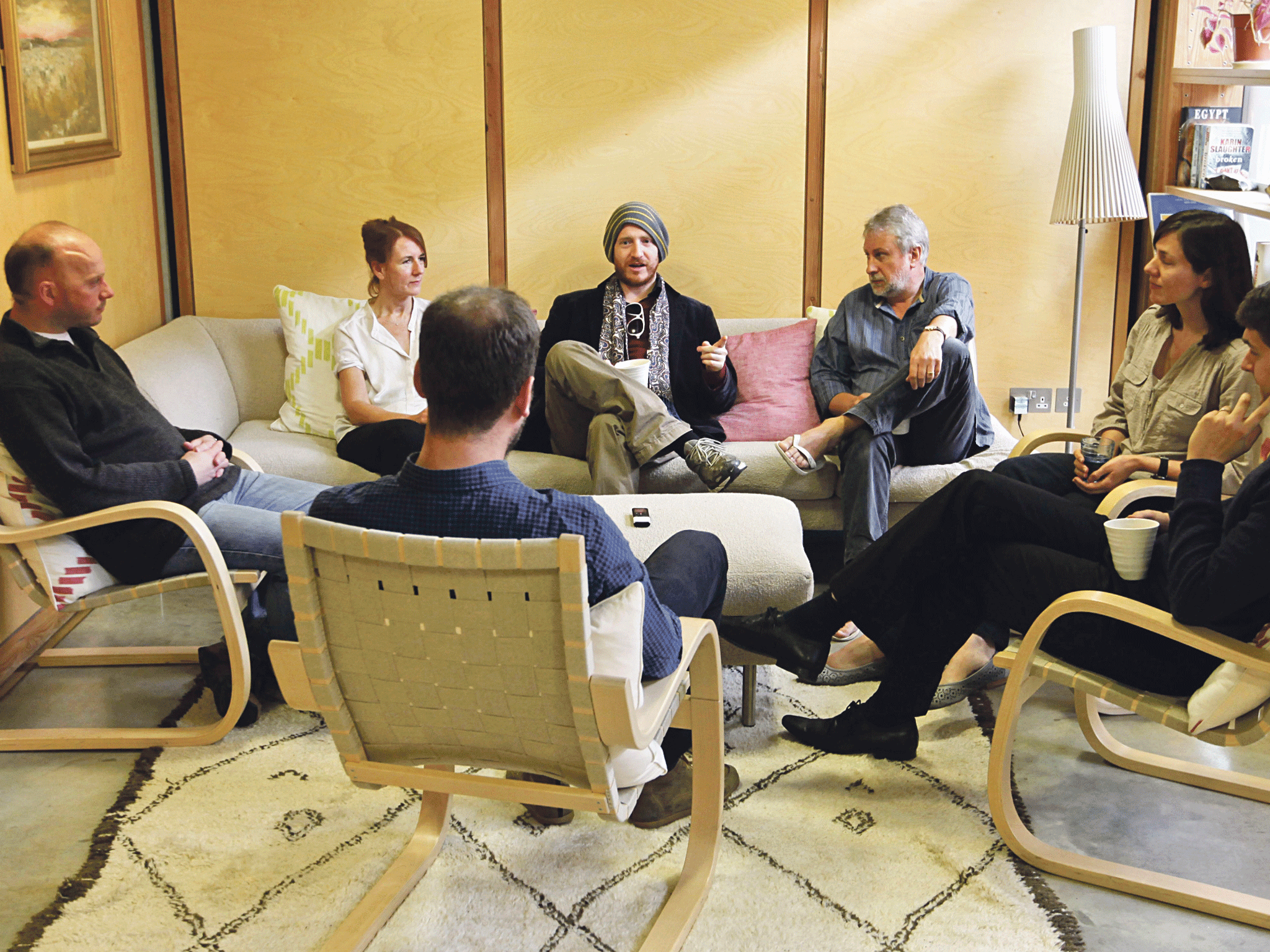 Talking cure: Simon Usborne (back to camera) joins the men's cancer group at Maggie's Centre, London