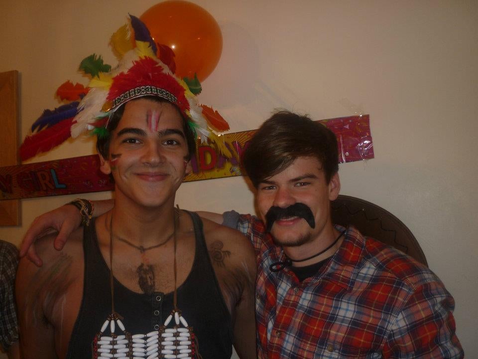 Village people: just another Halloween party for our hero (left, with chum)