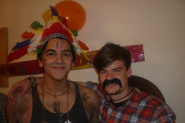 Village people: just another Halloween party for our hero (left, with chum)